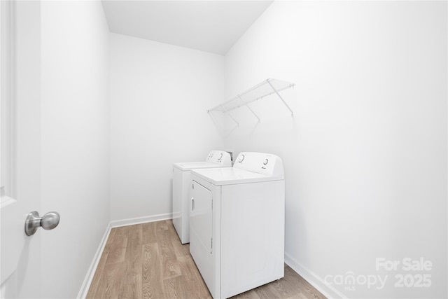 12548 Gotland Rd Unit 327, Midland, NC 28107 - laundry area featuring washer and clothes dryer and light wood-style floors