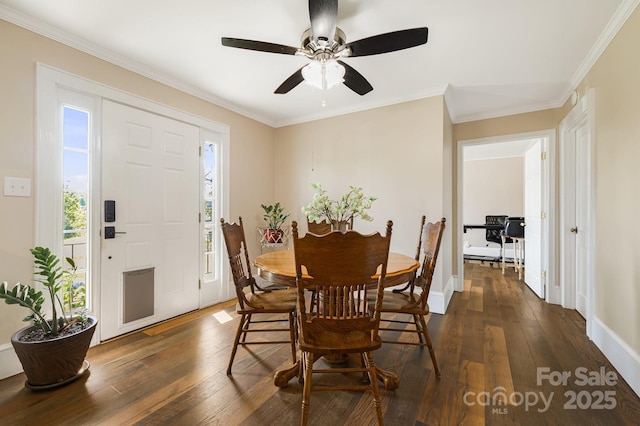 268 Oakland Rd, Spindale, NC 28160 - dining space featuring dark wood-style flooring, ornamental molding, and ceiling fan