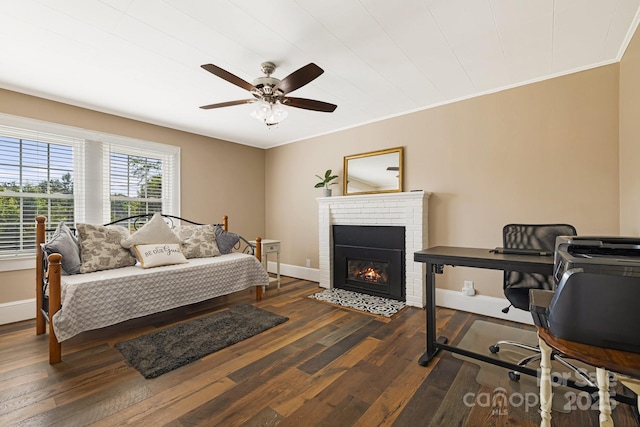 268 Oakland Rd, Spindale, NC 28160 - bedroom with dark wood-style floors, a fireplace, ceiling fan, and ornamental molding