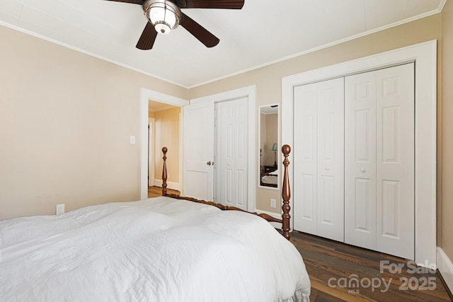 268 Oakland Rd, Spindale, NC 28160 - bedroom featuring dark wood-type flooring, crown molding, two closets, and a ceiling fan