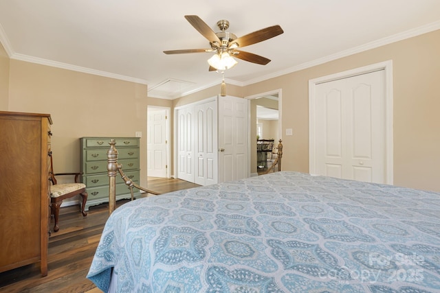 268 Oakland Rd, Spindale, NC 28160 - bedroom with two closets, dark wood-style floors, crown molding, and a ceiling fan