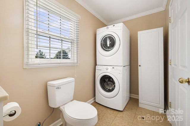 268 Oakland Rd, Spindale, NC 28160 - bathroom with estacked washer and dryer, crown molding, and tile patterned flooring