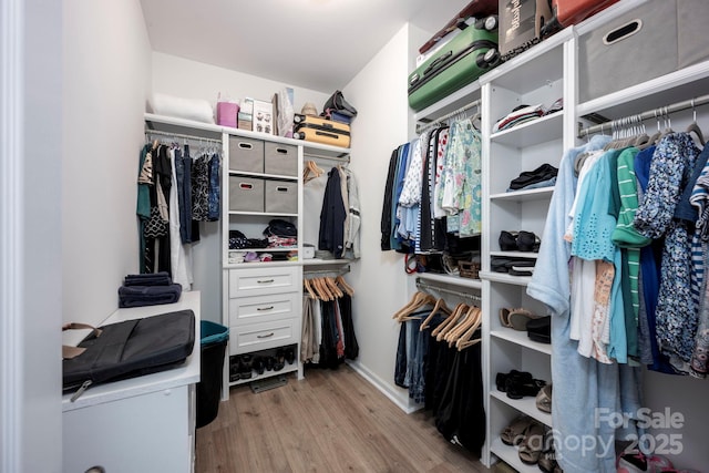 3595 Lake Bluff Dr, Sherrills Ford, NC 28673 - walk in closet featuring wood finished floors