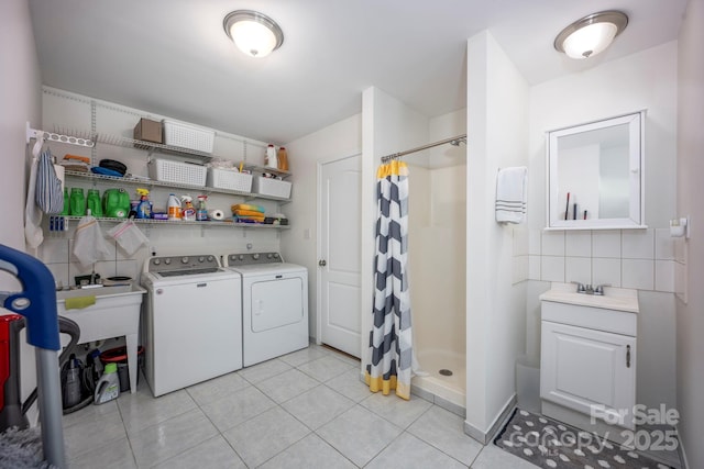 3595 Lake Bluff Dr, Sherrills Ford, NC 28673 - laundry room featuring washer and clothes dryer and light tile patterned floors