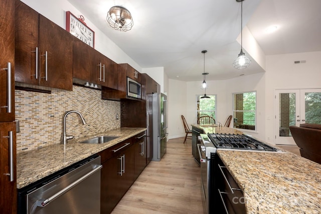 3595 Lake Bluff Dr, Sherrills Ford, NC 28673 - kitchen featuring stainless steel appliances, light wood-style floors, backsplash, light stone countertops, and dark brown cabinetry