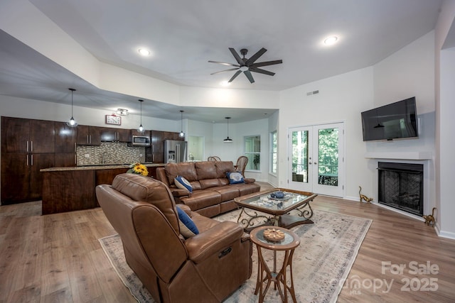 3595 Lake Bluff Dr, Sherrills Ford, NC 28673 - living room featuring ceiling fan, light wood-style flooring, a fireplace, and recessed lighting