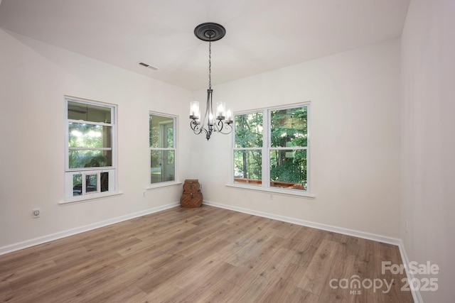 3595 Lake Bluff Dr, Sherrills Ford, NC 28673 - empty room with a chandelier and wood finished floors