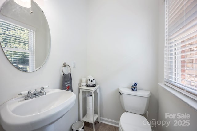 3595 Lake Bluff Dr, Sherrills Ford, NC 28673 - half bathroom featuring healthy amount of natural light and wood finished floors