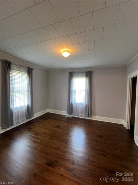 820 Suncrest Orchard Rd, North Wilkesboro, NC 28659 - empty room featuring ornamental molding, plenty of natural light, and dark wood finished floors
