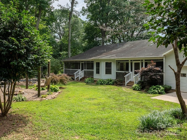 170 Eagle Dr, Salisbury, NC 28144 - view of front facade featuring a sunroom, a front yard, and a shingled roof