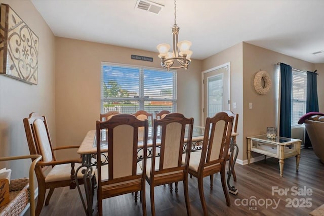 6340 Ziegler Ln Unit 148-A, Charlotte, NC 28269 - dining room featuring wood finished floors, a chandelier, and plenty of natural light