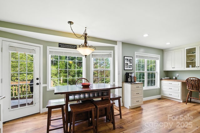 5172 Butner Dr, Hickory, NC 28602 - dining area featuring built in study area, light wood-style flooring, and recessed lighting