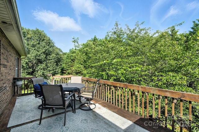 5172 Butner Dr, Hickory, NC 28602 - deck with outdoor dining space and a forest view