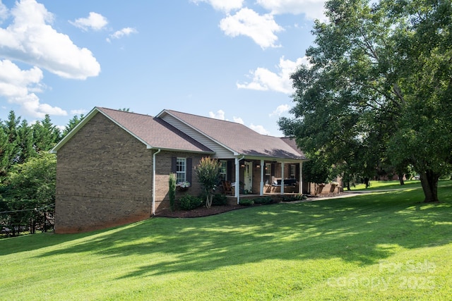 5172 Butner Dr, Hickory, NC 28602 - rear view of property featuring a porch, brick siding, and a lawn