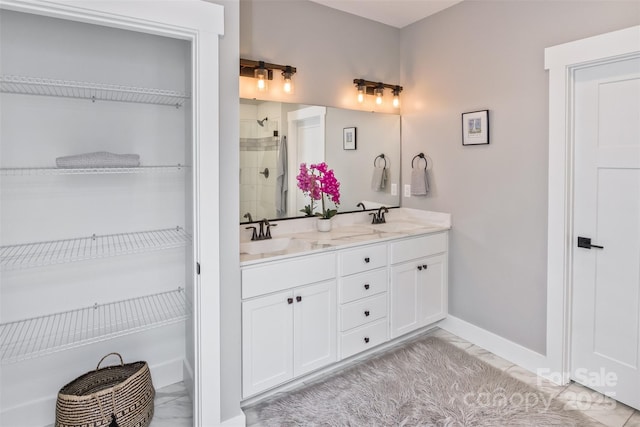 11 S Pine Dr, Weaverville, NC 28787 - full bathroom featuring marble finish floors, double vanity, tiled shower, and a walk in closet