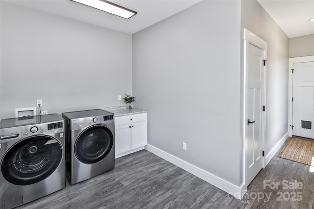 11 S Pine Dr, Weaverville, NC 28787 - washroom featuring washer and dryer, dark wood-type flooring, and cabinet space