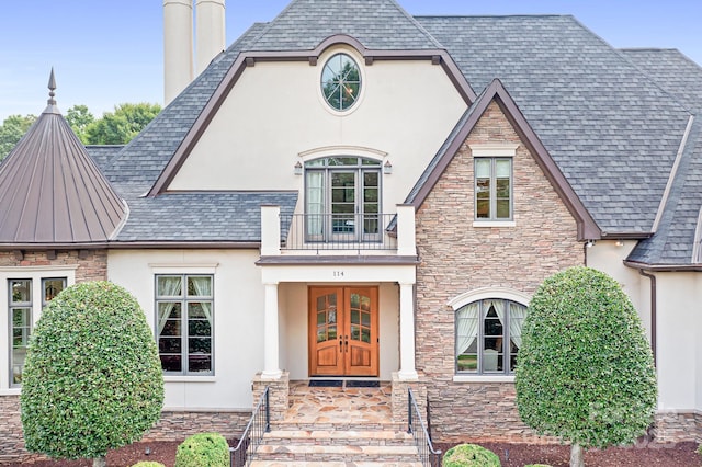 114 Thurstons Way, Mooresville, NC 28117 - view of front of house featuring stucco siding, french doors, a balcony, and stone siding