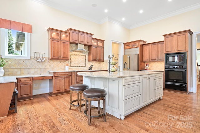 114 Thurstons Way, Mooresville, NC 28117 - kitchen with black appliances, a warming drawer, a kitchen island, brown cabinetry, and ornamental molding