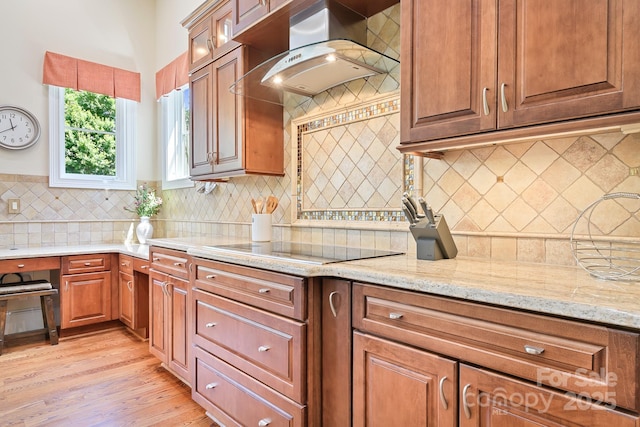 114 Thurstons Way, Mooresville, NC 28117 - kitchen featuring exhaust hood, light wood-style flooring, light stone counters, tasteful backsplash, and black electric cooktop