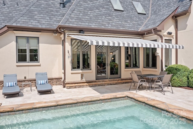 114 Thurstons Way, Mooresville, NC 28117 - rear view of house with stucco siding, a patio area, an outdoor pool, a shingled roof, and french doors