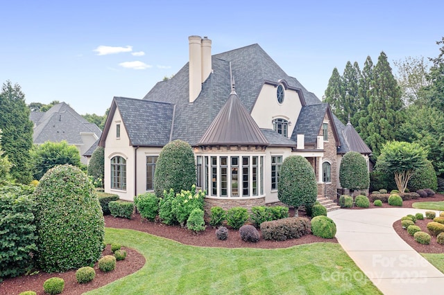 114 Thurstons Way, Mooresville, NC 28117 - view of home's exterior with stucco siding, a yard, stone siding, and a standing seam roof