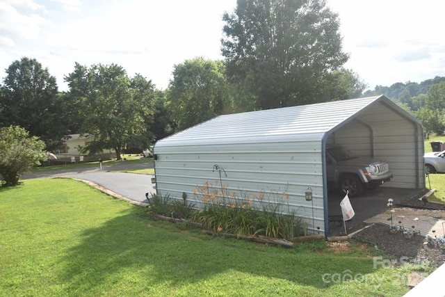 4854 Elk Ct, Morganton, NC 28655 - garage with a detached carport