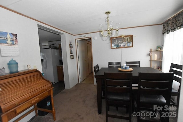 4854 Elk Ct, Morganton, NC 28655 - dining space featuring crown molding, a chandelier, and carpet flooring