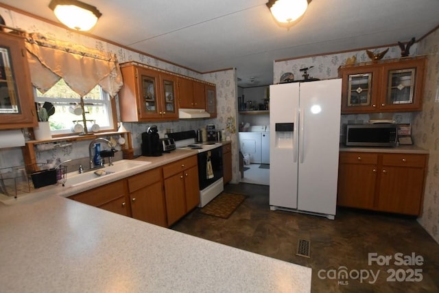 4854 Elk Ct, Morganton, NC 28655 - kitchen with white refrigerator with ice dispenser, electric range oven, stainless steel microwave, under cabinet range hood, and brown cabinetry