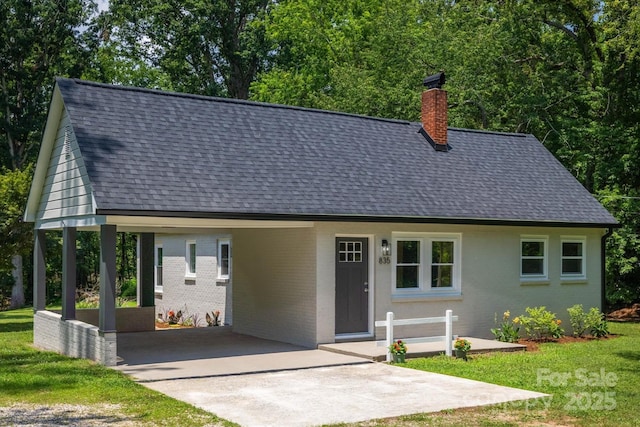 835 Vine Arden Rd, Morganton, NC 28655 - cape cod home featuring a shingled roof, concrete driveway, a chimney, and brick siding