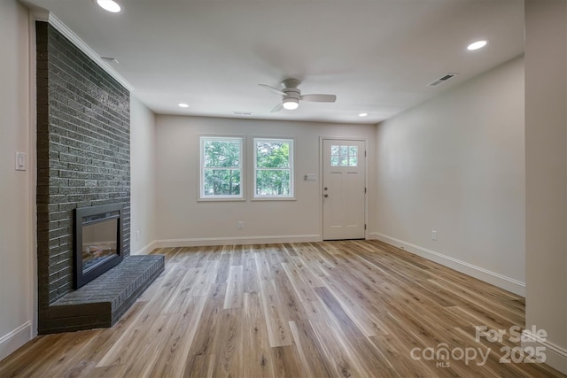 835 Vine Arden Rd, Morganton, NC 28655 - unfurnished living room featuring light wood-style flooring, ceiling fan, a fireplace, and recessed lighting