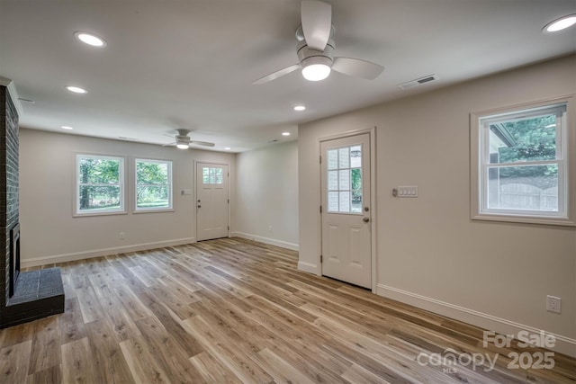 835 Vine Arden Rd, Morganton, NC 28655 - foyer entrance with a ceiling fan, a fireplace, light wood-style floors, and recessed lighting