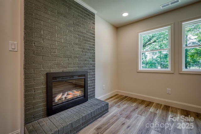 835 Vine Arden Rd, Morganton, NC 28655 - detailed view of a brick fireplace, wood finished floors, and recessed lighting