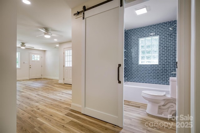 835 Vine Arden Rd, Morganton, NC 28655 - bathroom with  shower combination, a ceiling fan, wood finished floors, and recessed lighting