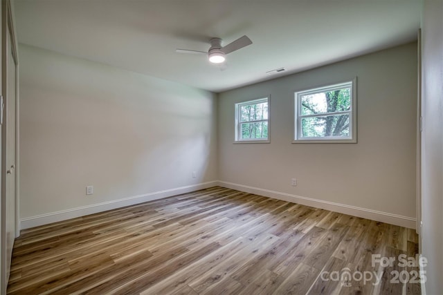835 Vine Arden Rd, Morganton, NC 28655 - unfurnished room with wood finished floors and a ceiling fan