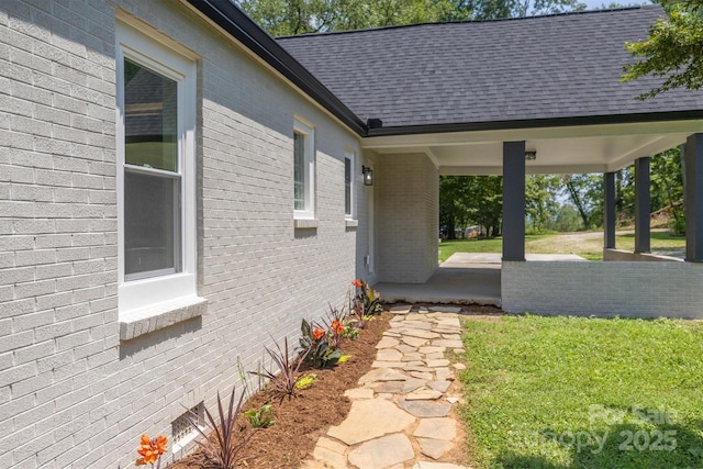835 Vine Arden Rd, Morganton, NC 28655 - view of side of home featuring brick siding, a shingled roof, and a lawn