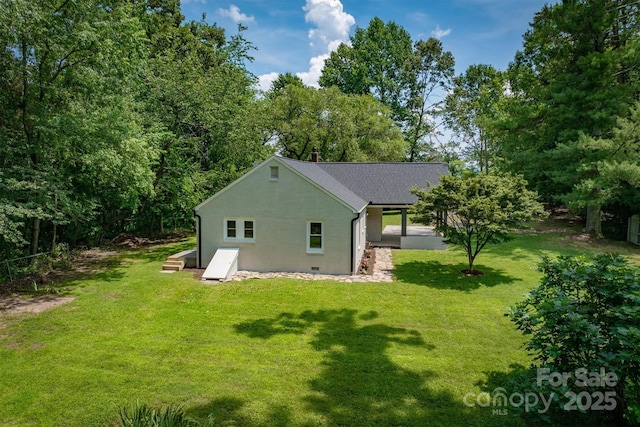 835 Vine Arden Rd, Morganton, NC 28655 - rear view of property featuring a lawn, stucco siding, and a shingled roof