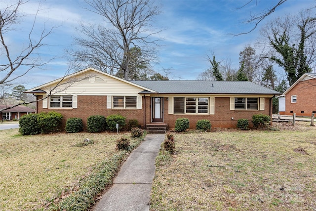 4601 Mendham Dr, Charlotte, NC 28215 - single story home with brick siding and a front yard