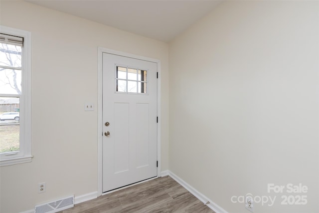 4601 Mendham Dr, Charlotte, NC 28215 - foyer entrance featuring light wood finished floors and baseboards