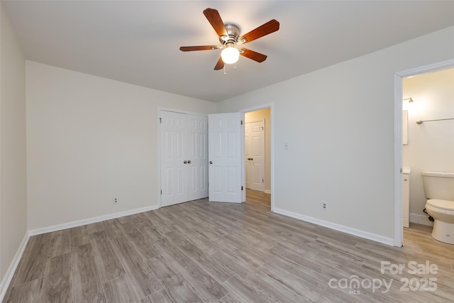4601 Mendham Dr, Charlotte, NC 28215 - unfurnished bedroom featuring light wood-style floors, connected bathroom, a closet, and ceiling fan