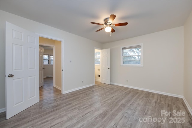 4601 Mendham Dr, Charlotte, NC 28215 - unfurnished bedroom featuring light wood-style floors and a ceiling fan