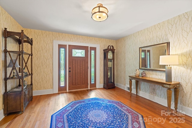 747 9th St NW, Hickory, NC 28601 - entryway with wood finished floors and wallpapered walls