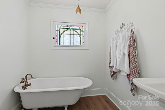 747 9th St NW, Hickory, NC 28601 - full bath with a soaking tub, wood finished floors, and ornamental molding