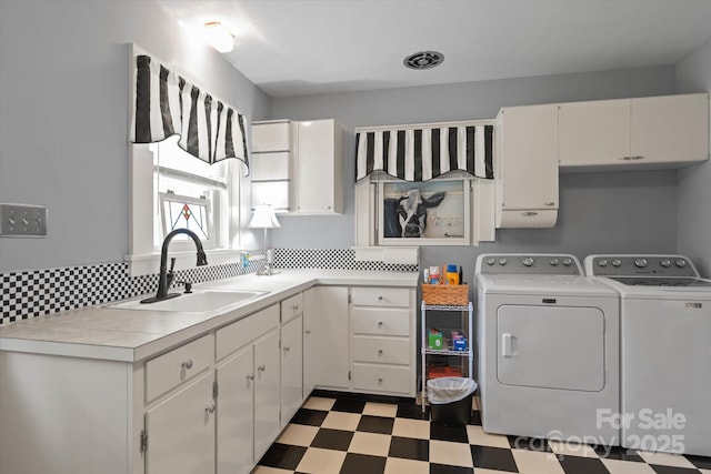 747 9th St NW, Hickory, NC 28601 - laundry area featuring separate washer and dryer, tile patterned floors, and cabinet space