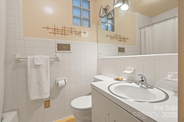 747 9th St NW, Hickory, NC 28601 - full bathroom with tile walls, vanity, and a shower with shower curtain