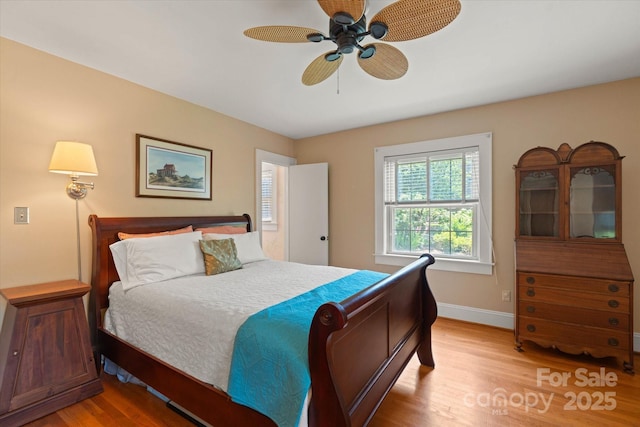 747 9th St NW, Hickory, NC 28601 - bedroom featuring light wood-style flooring and a ceiling fan