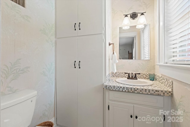 747 9th St NW, Hickory, NC 28601 - half bathroom with vanity, wallpapered walls, and a closet