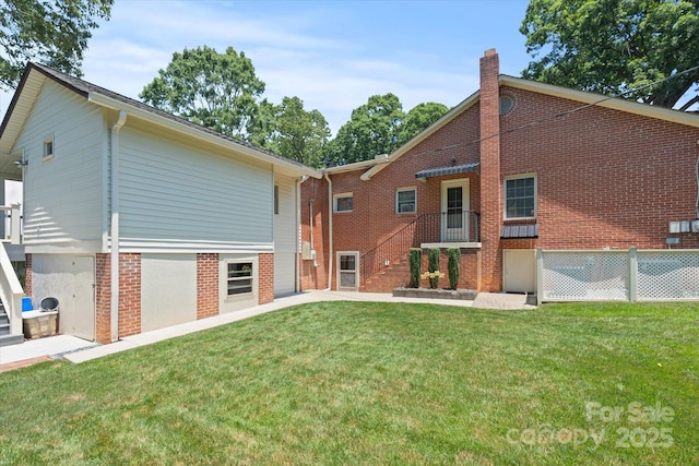 747 9th St NW, Hickory, NC 28601 - back of house featuring a chimney and brick siding