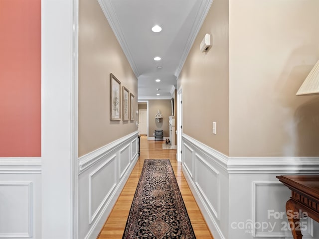 5572 Yorke St NW, Concord, NC 28027 - hallway featuring a wainscoted wall, ornamental molding, a decorative wall, light wood-style floors, and recessed lighting