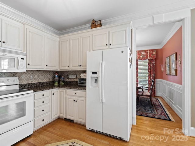 5572 Yorke St NW, Concord, NC 28027 - kitchen with white appliances, light wood-style floors, crown molding, white cabinets, and decorative backsplash