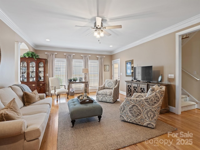 5572 Yorke St NW, Concord, NC 28027 - living area with wood finished floors, stairway, ceiling fan, recessed lighting, and ornamental molding